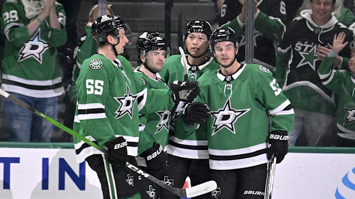 Feb 25, 2026; Dallas, Texas, USA;  Dallas Stars defenseman Thomas Harley (55) and center Mavrik Bourque (22) and left wing Jason Robertson (21) center Wyatt Johnston (53) celebrates a goal scored by Johnston against the Seattle Kraken during the first period at the American Airlines Center. Mandatory Credit: Jerome Miron-Imagn Images
