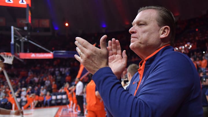 Nov 13, 2024; Champaign, Illinois, USA;  Illinois Fighting Illini head coach Brad Underwood applauds the crowd before a game against the Oakland Golden Grizzlies at State Farm Center. 
