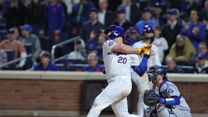 New York Mets first base Pete Alonso (20) hits a single in the eighth inning against the Los Angeles Dodgers during game five of the NLCS for the 2024 MLB playoffs at Citi Field on Oct 18.