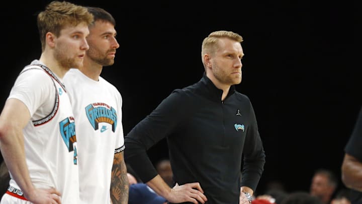 Apr 13, 2025; Memphis, Tennessee, USA Memphis Grizzlies interim head coach Tuomas Iisalo (right) looks on during the first quarter against the Dallas Mavericks at FedExForum. Mandatory Credit: Petre Thomas-Imagn Images