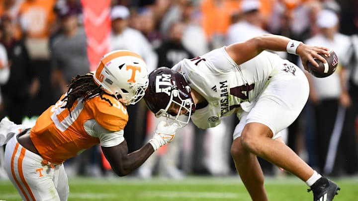 Tennessee defensive lineman Roman Harrison (30) face masks Texas A&M quarterback Max Johnson
