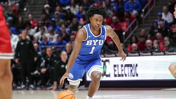 Jan 10, 2026; Salt Lake City, Utah, USA;  BYU Cougars guard Robert Wright III (1) drives during the first half against the Utah Utes at Jon M. Huntsman Center. Mandatory Credit: Aaron Baker-Imagn Images