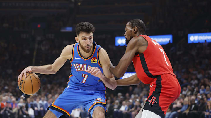 Oct 21, 2025; Oklahoma City, Oklahoma, USA; Oklahoma City Thunder center Chet Holmgren (7) drives to the basket against Houston Rockets forward Kevin Durant (7) during the first half at Paycom Center. Mandatory Credit: Alonzo Adams-Imagn Images