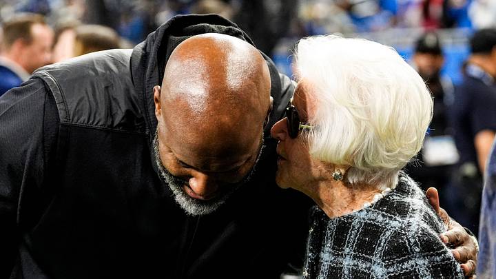 Detroit Lions general manager Brad Holmes talks to Martha Ford during warmup ahead of the Green Bay Packers game at Ford Field in Detroit on Thursday, Nov. 27, 2025. Detroit Lions general manager Brad Holmes talks to Martha Ford during warmup ahead of the Green Bay Packers game at Ford Field in Detroit on Thursday, Nov. 27, 2025.