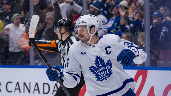 Feb 8, 2025; Vancouver, British Columbia, CAN; Toronto Maple Leafs forward Auston Matthews (34) celebrates a goal scored defenseman Morgan Rielly (44) against the Vancouver Canucks in the second period at Rogers Arena. Mandatory Credit: Bob Frid-Imagn Images