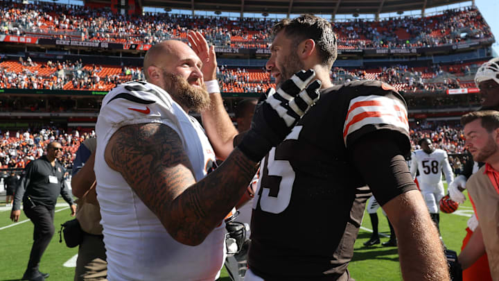 Sep 7, 2025; Cleveland, Ohio, USA; Cincinnati Bengals guard Dalton Risner (66) and Cleveland Browns quarterback Joe Flacco (15) greet each other after a game at Huntington Bank Field. Mandatory Credit: Scott Galvin-Imagn Images