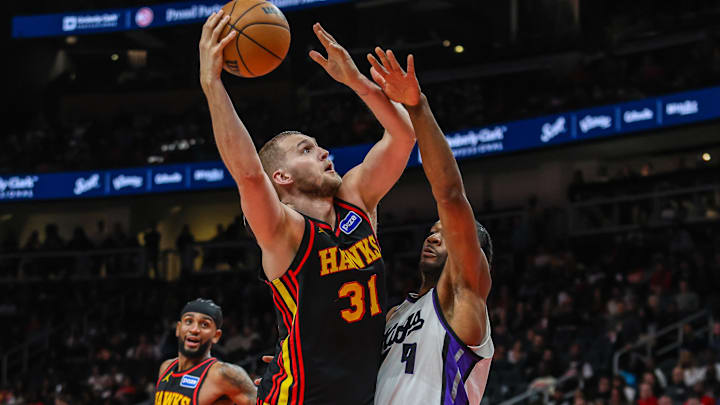 Mar 28, 2026; Atlanta, Georgia, USA; Atlanta Hawks center Jock Landale (31) shoots the ball against Sacramento Kings forward Precious Achiuwa (9) during the third quarter at State Farm Arena. Mandatory Credit: Jordan Godfree-Imagn Images