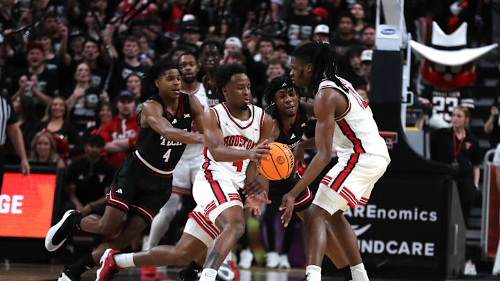 Feb 24, 2025; Lubbock, Texas, USA; Houston Cougars guard LJ Cryer (4) works the ball in front of Texas Tech Red Raiders guard Christian Anderson (4) in the second half at United Supermarkets Arena. Mandatory Credit: Michael C. Johnson-Imagn Images Feb 24, 2025; Lubbock, Texas, USA; Houston Cougars guard LJ Cryer (4) works the ball in front of Texas Tech Red Raiders guard Christian Anderson (4) in the second half at United Supermarkets Arena. Mandatory Credit: Michael C. Johnson-Imagn Images