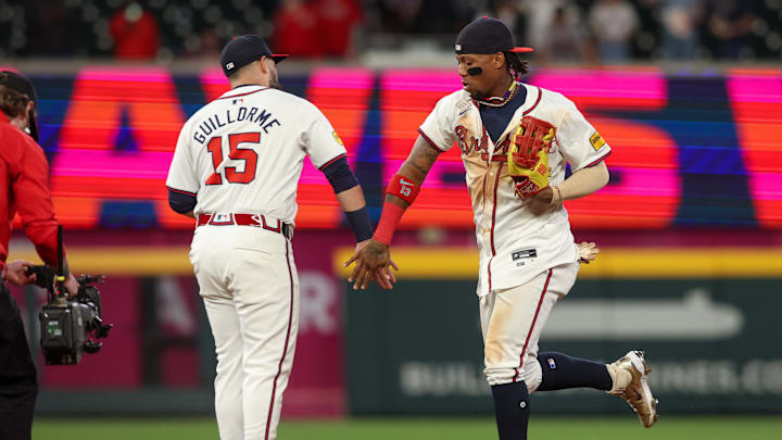 Atlanta Braves second baseman Luis Guillorme (15) and right fielder Ronald Acuña Jr celebrate beating the Miami Marlins in Truist Park on Monday night Atlanta Braves second baseman Luis Guillorme (15) and right fielder Ronald Acuña Jr celebrate beating the Miami Marlins in Truist Park on Monday night