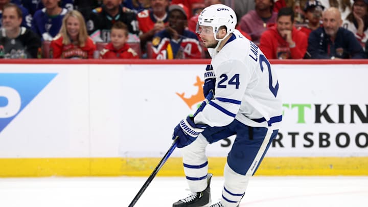 May 11, 2025; Sunrise, Florida, USA; Toronto Maple Leafs left wing Scott Laughton (24) skates with the puck against the Florida Panthers during the second period in game four of the second round of the 2025 Stanley Cup Playoffs at Amerant Bank Arena. Mandatory Credit: Kim Klement Neitzel-Imagn Images