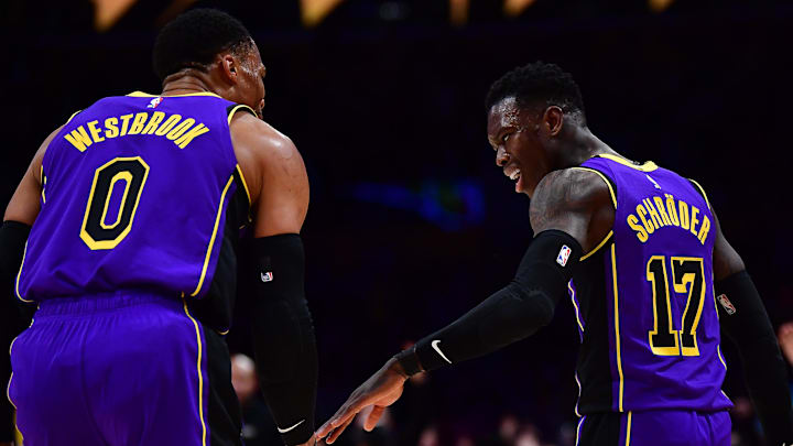 Dec 16, 2022; Los Angeles, California, USA; Los Angeles Lakers guards Dennis Schroder (17) and Russell Westbrook (0) during the second half at Crypto.com Arena. 