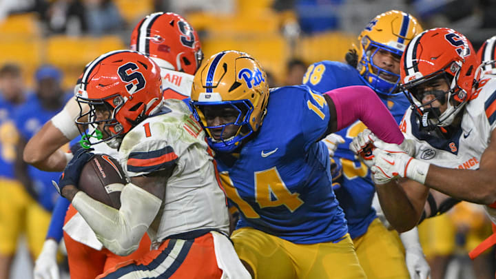 Oct 24, 2024; Pittsburgh, Pennsylvania, USA; Pittsburgh Panthers defensive lineman Chief Borders (14) tackles Syracuse Orange running back LeQuint Allen (1) during the second half at Acrisure Stadium. Mandatory Credit: Barry Reeger-Imagn Images