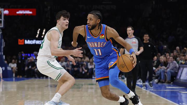 Mar 12, 2026; Oklahoma City, Oklahoma, USA; Oklahoma City Thunder guard Isaiah Joe (11) drives past Boston Celtics guard Hugo González (28) during the second quarter at Paycom Center. Mandatory Credit: Alonzo Adams-Imagn Images