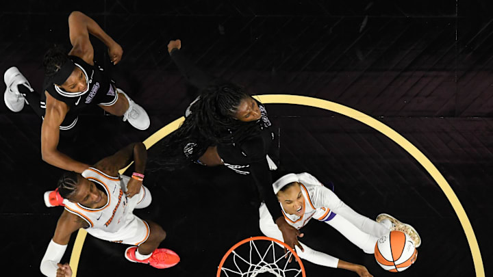 Aug 19, 2025; San Francisco, California, USA; Phoenix Mercury forward DeWanna Bonner (14) attempts a layup against Golden State Valkyries forward Laeticia Amihere (3) in the fourth quarter at Chase Center. Mandatory Credit: Eakin Howard-Imagn Images