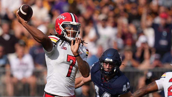 Maryland Terrapins quarterback Malik Washington (7) throws a pass against the UConn Huskies in the first quarter at Rentschler Field. Maryland Terrapins quarterback Malik Washington (7) throws a pass against the UConn Huskies in the first quarter at Rentschler Field.