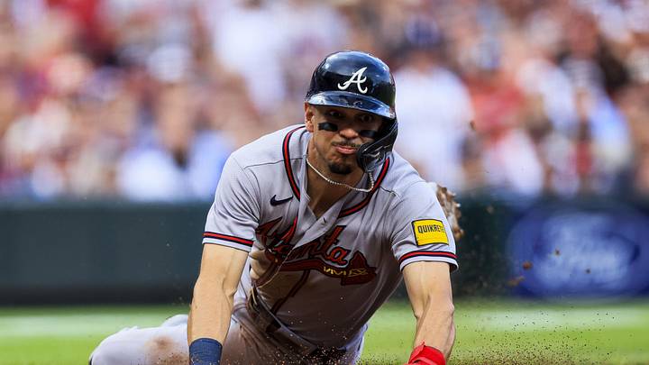 May 30, 2026; Cincinnati, Ohio, USA; Atlanta Braves third baseman Mauricio Dubon (14) attempts to steal home in the second inning against the Cincinnati Reds at Great American Ball Park. Mandatory Credit: Katie Stratman-Imagn Images