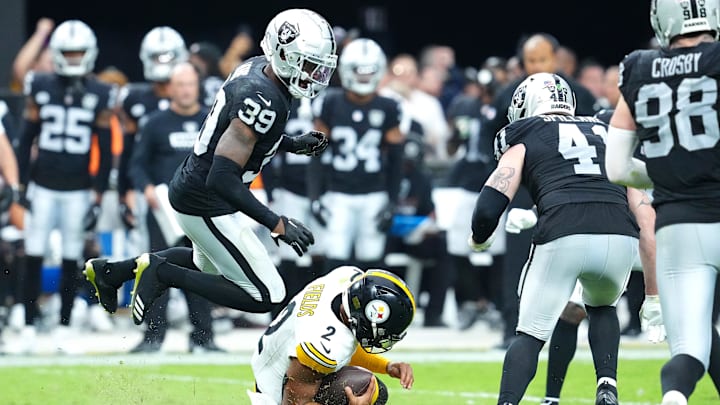 Oct 13, 2024; Paradise, Nevada, USA; Las Vegas Raiders cornerback Nate Hobbs (39) leaps over a sliding Pittsburgh Steelers quarterback Justin Fields (2) during the fourth quarter at Allegiant Stadium. Mandatory Credit: Stephen R. Sylvanie-Imagn Images Oct 13, 2024; Paradise, Nevada, USA; Las Vegas Raiders cornerback Nate Hobbs (39) leaps over a sliding Pittsburgh Steelers quarterback Justin Fields (2) during the fourth quarter at Allegiant Stadium. Mandatory Credit: Stephen R. Sylvanie-Imagn Images