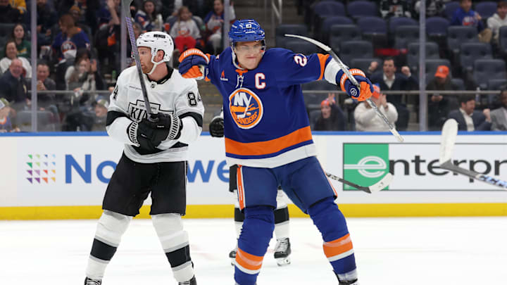 Dec 10, 2024; Elmont, New York, USA; New York Islanders left wing Anders Lee (27) celebrates his goal against Los Angeles Kings defenseman Vladislav Gavrikov (84) during the second period at UBS Arena. Mandatory Credit: Brad Penner-Imagn Images