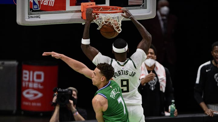 Apr 8, 2021; Dallas, Texas, USA; Milwaukee Bucks center Bobby Portis (9) dunks the ball past Dallas Mavericks center Dwight Powell (7) during the second half at the American Airlines Center. Mandatory Credit: Jerome Miron-Imagn Images Apr 8, 2021; Dallas, Texas, USA; Milwaukee Bucks center Bobby Portis (9) dunks the ball past Dallas Mavericks center Dwight Powell (7) during the second half at the American Airlines Center. Mandatory Credit: Jerome Miron-Imagn Images