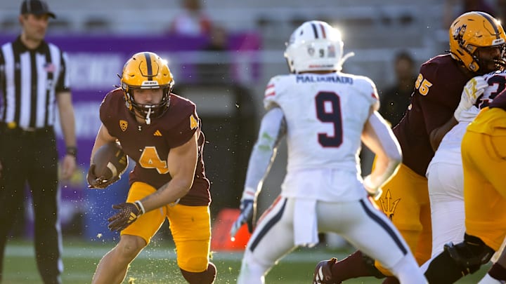 Nov 25, 2023; Tempe, Arizona, USA; Arizona State Sun Devils running back Cameron Skattebo (4) runs the ball against the Arizona Wildcats in the second half of the Territorial Cup at Mountain America Stadium. Mandatory Credit: Mark J. Rebilas-Imagn Images