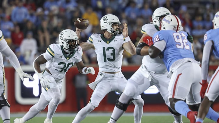 Nov 23, 2024; Houston, Texas, USA; Baylor Bears quarterback Sawyer Robertson (13) attempts a pass during the first quarter against the Houston Cougars at TDECU Stadium. Mandatory Credit: Troy Taormina-Imagn Images