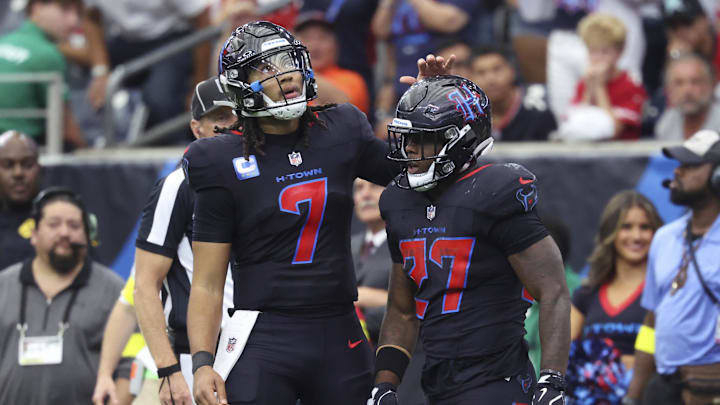 Oct 26, 2025; Houston, Texas, USA; Houston Texans quarterback C.J. Stroud (7) and running back Woody Marks (27) react after a play during the fourth quarter against the San Francisco 49ers at NRG Stadium. Mandatory Credit: Troy Taormina-Imagn Images