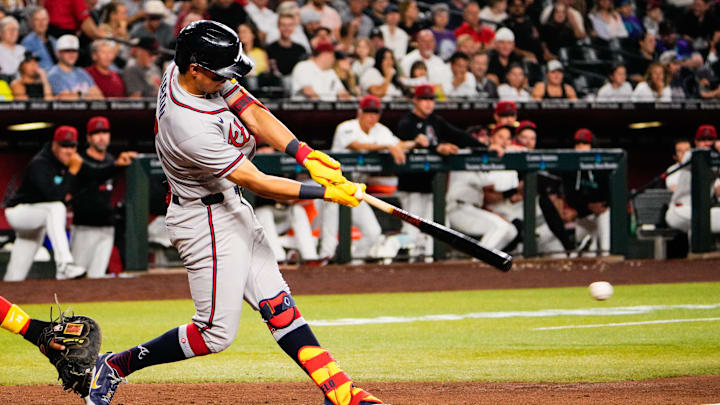 Apr 2, 2026; Phoenix, Arizona, USA; Atlanta Braves second baseman Mauricio Dubon (14) hits during the fifth inning at Chase Field against the Arizona Diamondbacks. Mandatory Credit: Arianna Grainey-Imagn Images