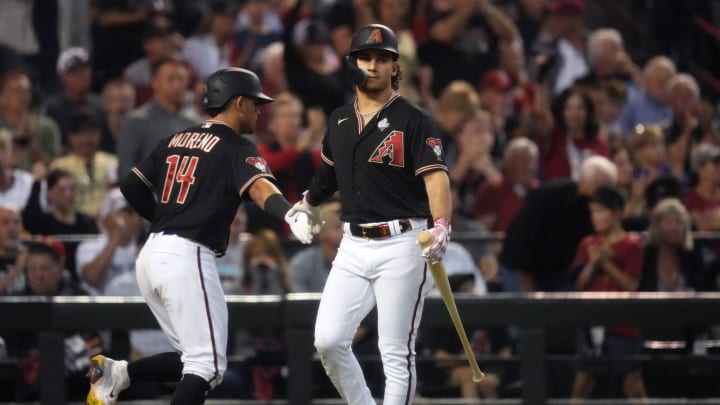 Arizona Diamondbacks center fielder Alek Thomas (5) congratulates catcher Gabriel Moreno (14) after scoring a run against the Texas Rangers during the fourth inning in Game 4 of the 2023 World Series at Chase Field in Phoenix, AZ. The DBacks lost to the Rangers 11-7, putting the Ranger at 3-1 in the World Series. Arizona Diamondbacks center fielder Alek Thomas (5) congratulates catcher Gabriel Moreno (14) after scoring a run against the Texas Rangers during the fourth inning in Game 4 of the 2023 World Series at Chase Field in Phoenix, AZ. The DBacks lost to the Rangers 11-7, putting the Ranger at 3-1 in the World Series.