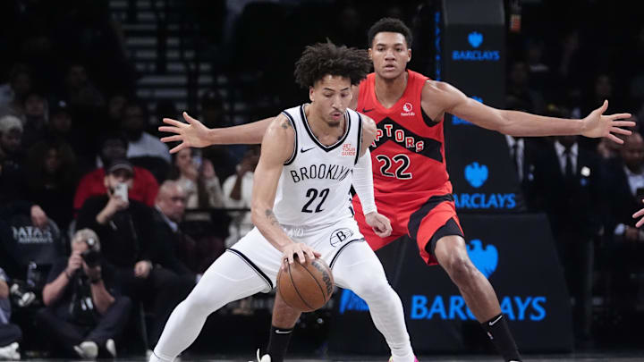 Oct 18, 2024; Brooklyn, New York, USA; Brooklyn Nets forward Jalen Wilson (22) dribbles the ball against Toronto Raptors center Ulrich Chomche (22) during the second half at Barclays Center. Mandatory Credit: Gregory Fisher-Imagn Images