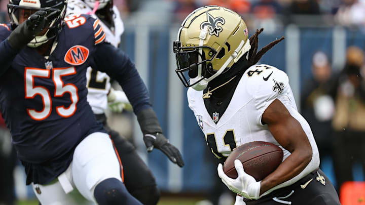Oct 19, 2025; Chicago, Illinois, USA; New Orleans Saints running back Alvin Kamara (41) rushes the ball against the Chicago Bears during the second half at Soldier Field. Mandatory Credit: Mike Dinovo-Imagn Images