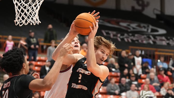 Feb 8, 2025; Stockton, California, USA; Pacific Tigers forward Elias Ralph (center) rebounds against Gonzaga Bulldogs forward Ben Gregg (center left) during the first half at Alex G. Spanos Center. Mandatory Credit: Darren Yamashita-Imagn Images