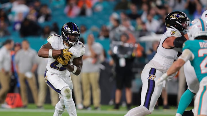 Baltimore Ravens running back Derrick Henry (22) runs for a gain during the fourth quarter against the Miami Dolphins at Hard Rock Stadium. Baltimore Ravens running back Derrick Henry (22) runs for a gain during the fourth quarter against the Miami Dolphins at Hard Rock Stadium.