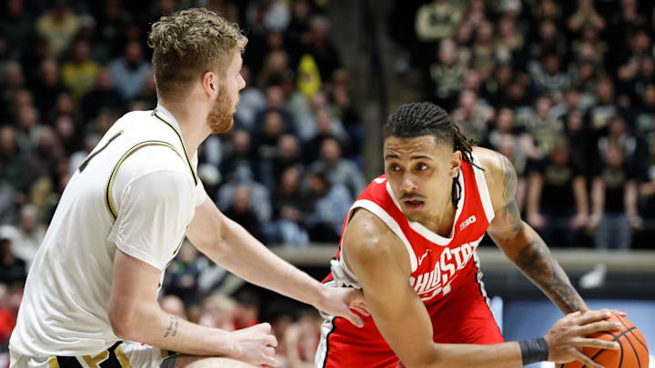 Purdue Boilermakers forward Caleb Furst (1) defends Ohio State Buckeyes forward Devin Royal (21) Tuesday, Jan. 21, 2025, during the NCAA men’s basketball game at Mackey Arena in West Lafayette, Ind.
