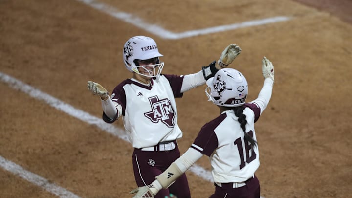 May 8, 2025; Athens, GA, USA; Texas A&M infielder KK Dement (16) and outfielder Kramer Eschete (91) react to the win after a game against South Carolina at Jack Turner Stadium. Mandatory Credit: Mady Mertens-Imagn Images