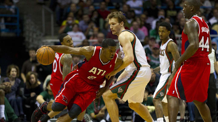 Mar 27, 2012; Milwaukee, WI, USA;  Atlanta Hawks guard Joe Johnson (2) drives around Milwaukee Bucks forward Mike Dunleavy (17) during the fourth quarter at the Bradley Center.  The Bucks defeated the Hawks 108-101.  Mandatory Credit: Jeff Hanisch-Imagn Images