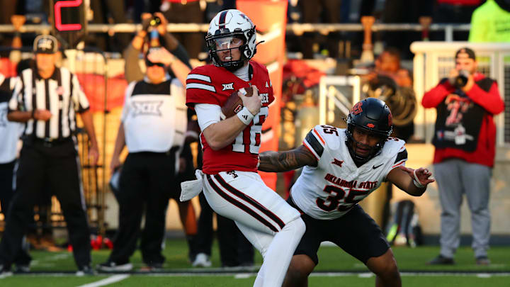 Oct 25, 2025; Lubbock, Texas, USA;  Oklahoma State Cowboys defensive back Possa Utu (35) pressures Texas Tech Red Raiders quarterback (16) Holden Phillips in the second half at Jones AT&T Stadium. Mandatory Credit: Michael C. Johnson-Imagn Images