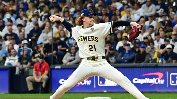 Oct 24, 2026; Milwaukee, Wisconsin, USA;  Milwaukee Brewers pitcher Dustin May (21) throws a pitch against the Tampa Bay Rays during the fifth inning in game two of the 2026 World Series at American Family Field.  Mandatory Credit: Benny Sieu-Imagn Images