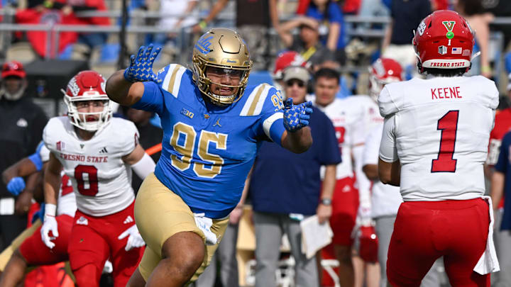 Nov 30, 2024; Pasadena, California, USA; UCLA Bruins defensive lineman Sitiveni Havili Kaufusi (95) pressures Fresno State Bulldogs quarterback Mikey Keene (1) during the second quarter at Rose Bowl. Mandatory Credit: Robert Hanashiro-Imagn Images Nov 30, 2024; Pasadena, California, USA; UCLA Bruins defensive lineman Sitiveni Havili Kaufusi (95) pressures Fresno State Bulldogs quarterback Mikey Keene (1) during the second quarter at Rose Bowl. Mandatory Credit: Robert Hanashiro-Imagn Images