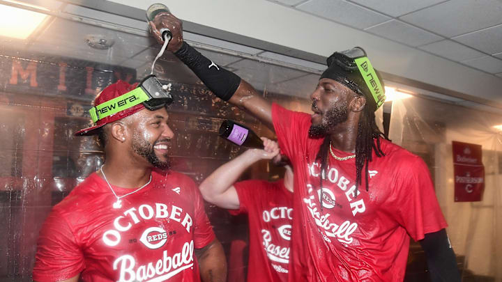 Sep 28, 2025; Milwaukee, Wisconsin, USA;  Cincinnati Reds shortstop Elly De La Cruz (right) celebrates after the Reds clinched a wild card spot after the game against the Milwaukee Brewers at American Family Field. Mandatory Credit: Benny Sieu-Imagn Images