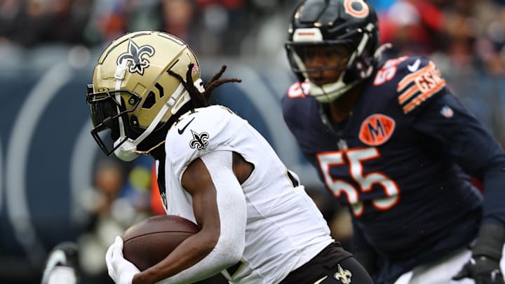 Oct 19, 2025; Chicago, Illinois, USA; New Orleans Saints running back Alvin Kamara (41) rushes the ball against the Chicago Bears during the first quarter at Soldier Field. Mandatory Credit: Mike Dinovo-Imagn Images