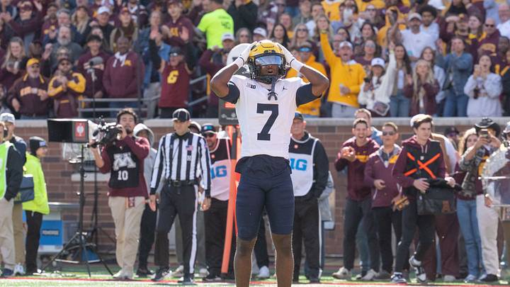 Oct 3, 2026; Minneapolis, Minnesota, USA;  Michigan Wolverines defensive back Chris Bracy (7) gestures to the referee after being called for pass interference against Minnesota Golden Gophers wide receiver Noah Jennings (13) in the end zone during the first quarter at Huntington Bank Stadium.  Mandatory Credit: Matt Blewett-Imagn Images