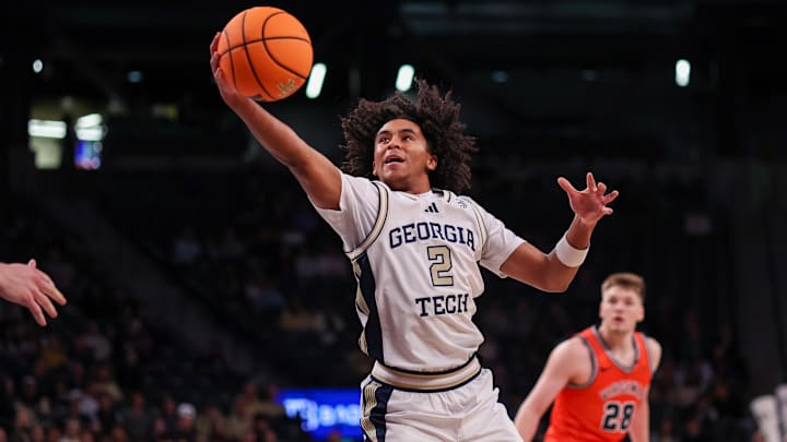 Feb 18, 2026; Atlanta, Georgia, USA; Georgia Tech Yellow Jackets guard Eric Chatfield Jr. (2) grabs a rebound against the Virginia Cavaliers in the first half at McCamish Pavilion. Mandatory Credit: Brett Davis-Imagn Images