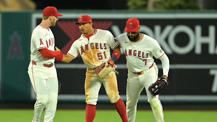 Jul 28, 2025; Anaheim, California, USA; Los Angeles Angels left fielder Taylor Ward (3), Los Angeles Angels center fielder Jo Adell (7) and Los Angeles Angels right fielder Gustavo Campero (51) head off the field after the final out of the ninth inning defeating the Texas Rangers at Angel Stadium. Mandatory Credit: Jayne Kamin-Oncea-Imagn Images