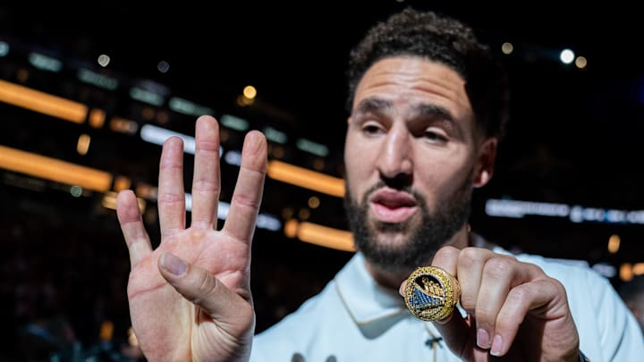 October 18, 2022; San Francisco, California, USA; Golden State Warriors guard Klay Thompson (11) shows his championship ring October 18, 2022; San Francisco, California, USA; Golden State Warriors guard Klay Thompson (11) shows his championship ring