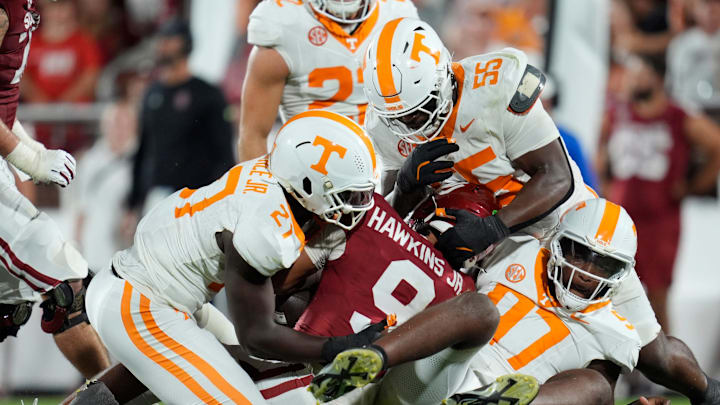 Oklahoma Sooners quarterback Michael Hawkins Jr. (9) is brought down by Tennessee Volunteers defensive lineman James Pearce Jr. (27), defensive lineman Omarr Norman-Lott (55) and defensive lineman Jayson Jenkins (97) during a college football game between the University of Oklahoma Sooners (OU) and the Tennessee Volunteers at Gaylord Family - Oklahoma Memorial Stadium in Norman, Okla., Saturday, Sept. 21, 2024.