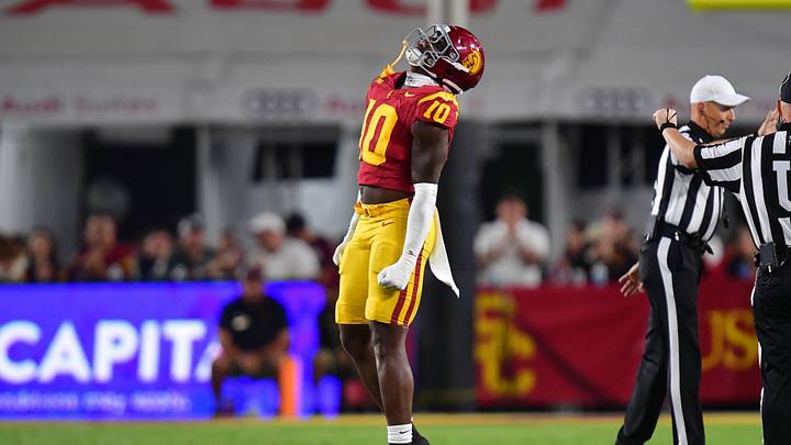 Sep 20, 2025; Los Angeles, California, USA; Southern California Trojans defensive end Braylan Shelby (10) reacts after bringing down Michigan State Spartans quarterback Aidan Chiles (2) during the first half at the Los Angeles Memorial Coliseum. Mandatory Credit: Gary A. Vasquez-Imagn Images