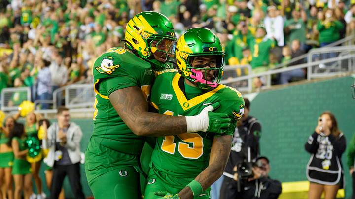 Oregon offensive lineman Ziyare Addison, left, celebrates a touchdown by Oregon wide receiver Messiah Hampton as the Oregon Ducks host the Portland State Vikings on Sept. 18, 2026, at Autzen Stadium in Eugene, Oregon.