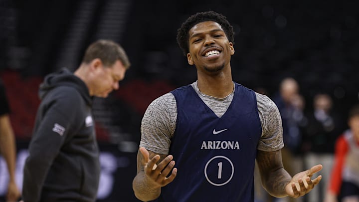 Mar 26, 2025; Newark, NJ, USA; Arizona Wildcats guard Caleb Love (1) reacts during a practice session in front of head coach Tommy Lloyd in preparation for an East Regional semifinal game against the Duke basketball team at Prudential Center.