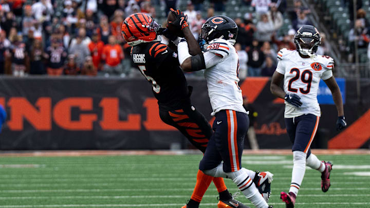 Cincinnati Bengals wide receiver Tee Higgins (5) catches a pass as Chicago Bears defensive back Jaquan Brisker (9) defends in the fourth quarter of the NFL football game between Chicago Bears and Cincinnati Bengals at Paycor Stadium in Cincinnati on Nov. 2, 2025. Cincinnati Bengals wide receiver Tee Higgins (5) catches a pass as Chicago Bears defensive back Jaquan Brisker (9) defends in the fourth quarter of the NFL football game between Chicago Bears and Cincinnati Bengals at Paycor Stadium in Cincinnati on Nov. 2, 2025.