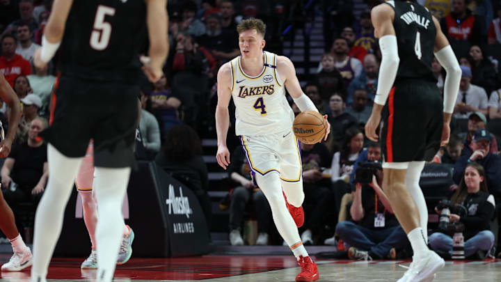 Apr 13, 2025; Portland, Oregon, USA; Los Angeles Lakers guard Dalton Knecht (4) brings the ball up the court against the Portland Trail Blazers in the second half at Moda Center. Mandatory Credit: Jaime Valdez-Imagn Images Apr 13, 2025; Portland, Oregon, USA; Los Angeles Lakers guard Dalton Knecht (4) brings the ball up the court against the Portland Trail Blazers in the second half at Moda Center. Mandatory Credit: Jaime Valdez-Imagn Images